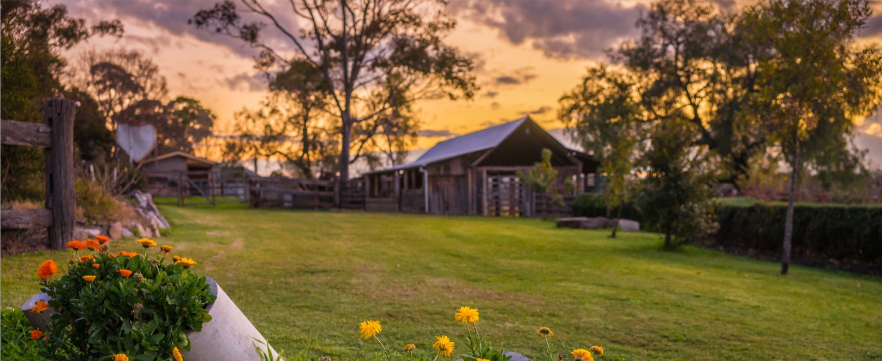 Image of farm buildings at sunset