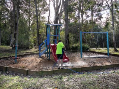 Play equipment being cleaned